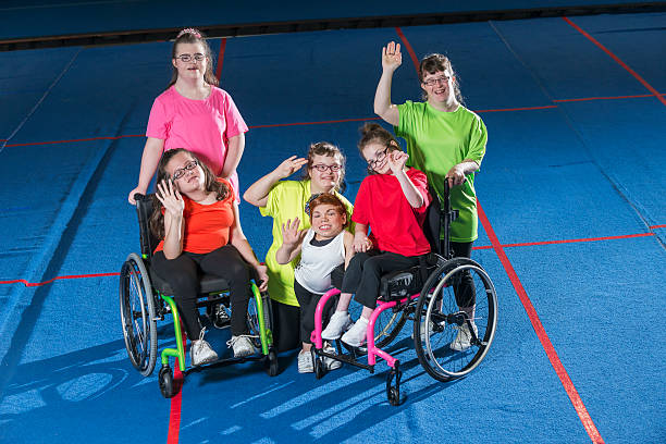 Group of people with disabilities posing for a photo